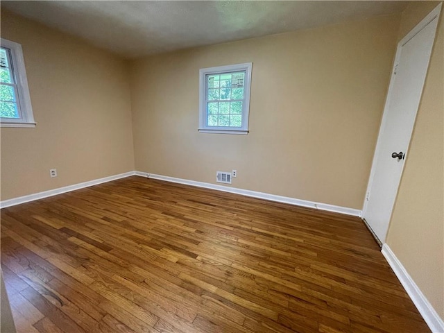 empty room with wood-type flooring