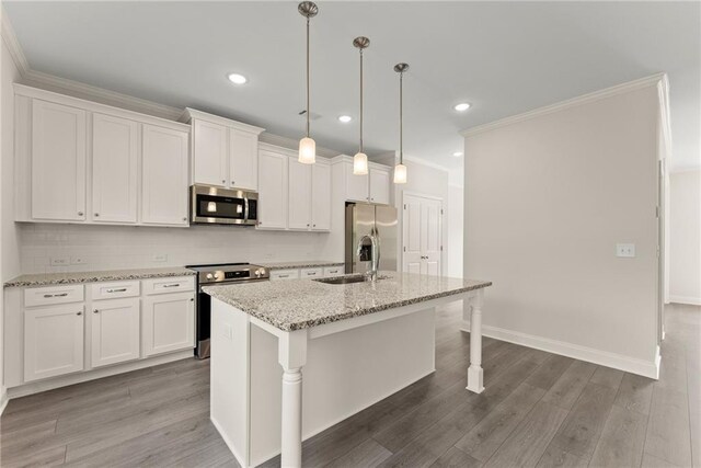 392 Brookstone Trl, Dawsonville, GA 30534 - kitchen with a sink, white cabinets, a center island with sink, and stainless steel appliances