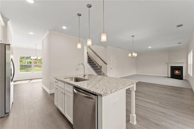 392 Brookstone Trl, Dawsonville, GA 30534 - kitchen with ornamental molding, baseboards, white cabinetry, a sink, and stainless steel appliances