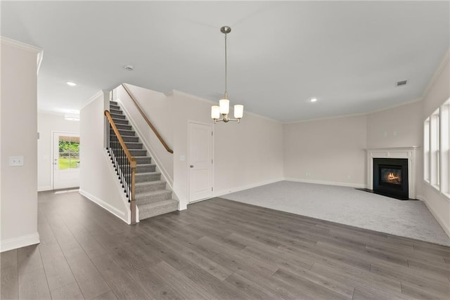 392 Brookstone Trl, Dawsonville, GA 30534 - unfurnished living room with ornamental molding and wood finished floors