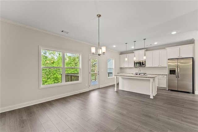 392 Brookstone Trl, Dawsonville, GA 30534 - kitchen with visible vents, crown molding, white cabinetry, a sink, and appliances with stainless steel finishes