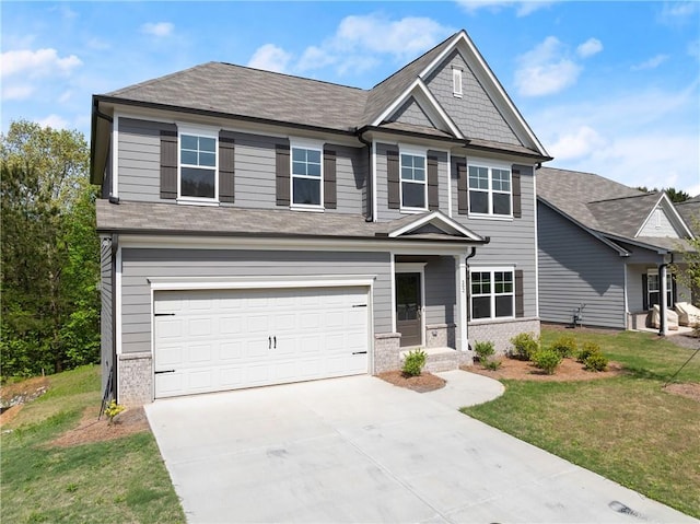 392 Brookstone Trl, Dawsonville, GA 30534 - craftsman-style house featuring a garage, roof with shingles, a front yard, and concrete driveway