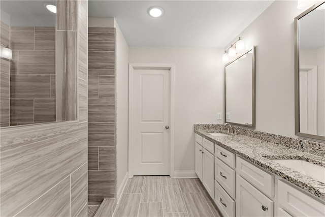 392 Brookstone Trl, Dawsonville, GA 30534 - bathroom featuring a sink, a walk in shower, baseboards, and double vanity