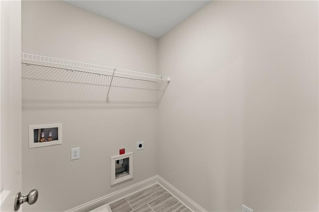 392 Brookstone Trl, Dawsonville, GA 30534 - laundry room with hookup for an electric dryer, laundry area, baseboards, and hookup for a washing machine