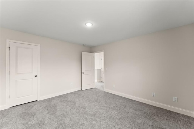 392 Brookstone Trl, Dawsonville, GA 30534 - unfurnished bedroom featuring baseboards and carpet