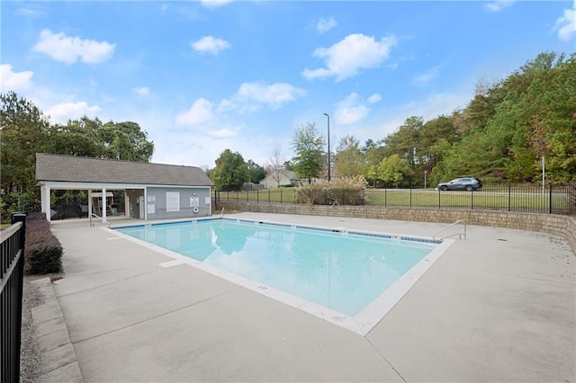 392 Brookstone Trl, Dawsonville, GA 30534 - pool featuring fence, an outdoor structure, and a patio area