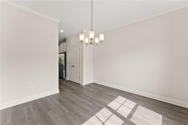 392 Brookstone Trl, Dawsonville, GA 30534 - unfurnished dining area featuring dark wood-style flooring, baseboards, an inviting chandelier, ornamental molding, and recessed lighting