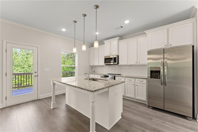 392 Brookstone Trl, Dawsonville, GA 30534 - kitchen with decorative backsplash, ornamental molding, white cabinets, a sink, and stainless steel appliances