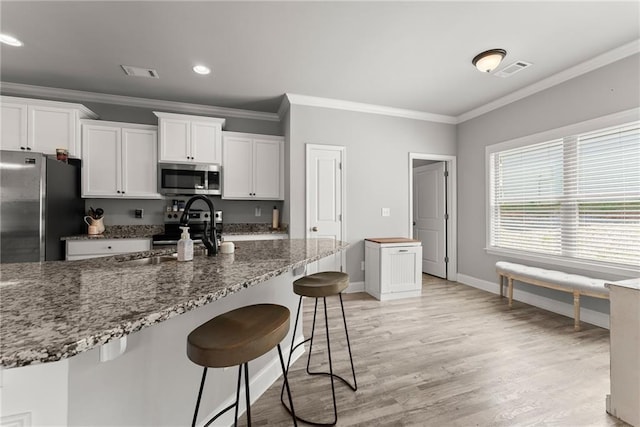4381 Highland Gate Parkway, Gainesville, GA 30506 - kitchen featuring white cabinets, stainless steel appliances, and visible vents
