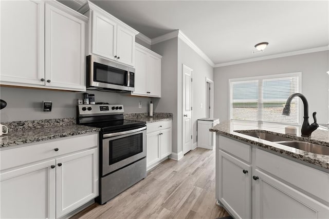 4381 Highland Gate Parkway, Gainesville, GA 30506 - kitchen featuring white cabinetry, a sink, ornamental molding, stainless steel appliances, and light wood-style flooring