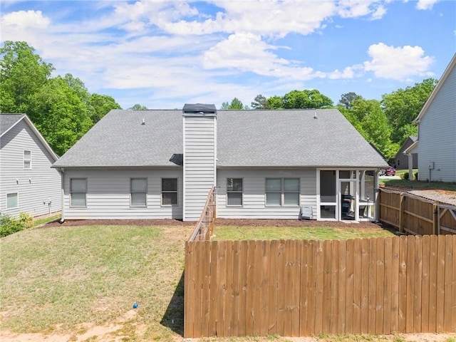 4381 Highland Gate Parkway, Gainesville, GA 30506 - back of property with fence, roof with shingles, a sunroom, a chimney, and a lawn