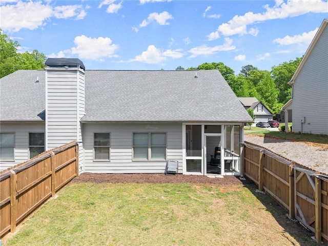 4381 Highland Gate Parkway, Gainesville, GA 30506 - rear view of property with a yard, a shingled roof, a fenced backyard, and a sunroom