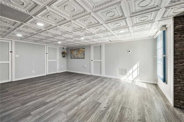 224 Celestial Ridge Dr, Dallas, GA 30132 - below grade area featuring an ornate ceiling and wood finished floors