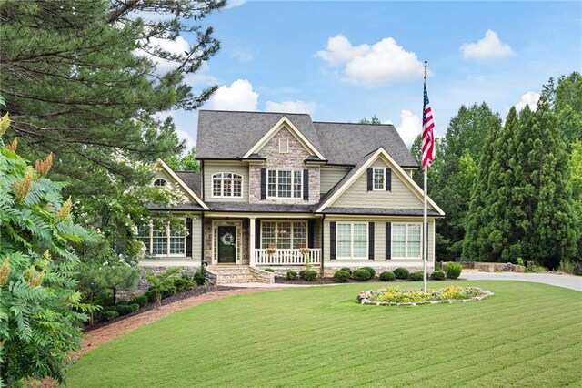 224 Celestial Ridge Dr, Dallas, GA 30132 - craftsman inspired home featuring stone siding, a front lawn, and covered porch