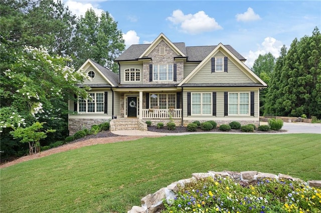 224 Celestial Ridge Dr, Dallas, GA 30132 - craftsman-style home featuring stone siding, a porch, and a front yard