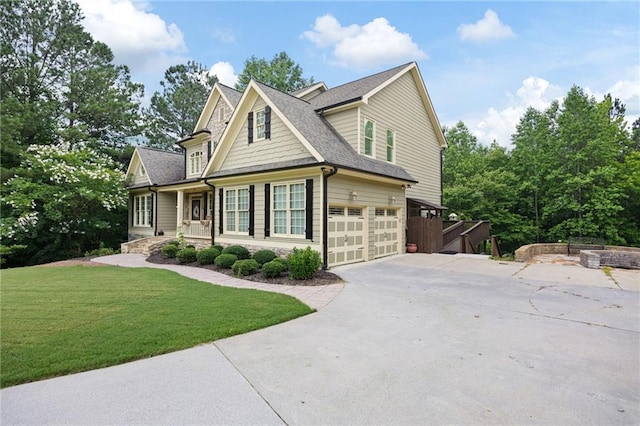 224 Celestial Ridge Dr, Dallas, GA 30132 - view of side of property with concrete driveway, a lawn, a garage, roof with shingles, and stone siding