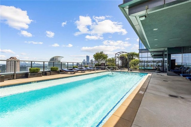 view of swimming pool featuring a patio