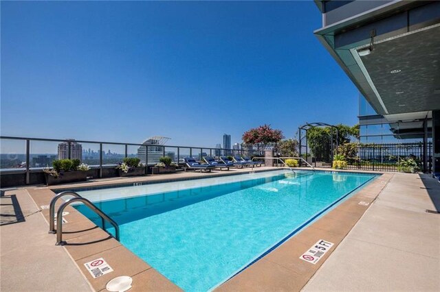 view of swimming pool with a patio area