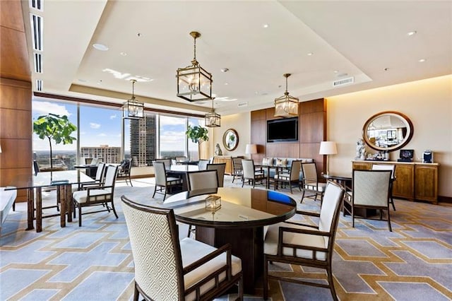 dining room with a tray ceiling