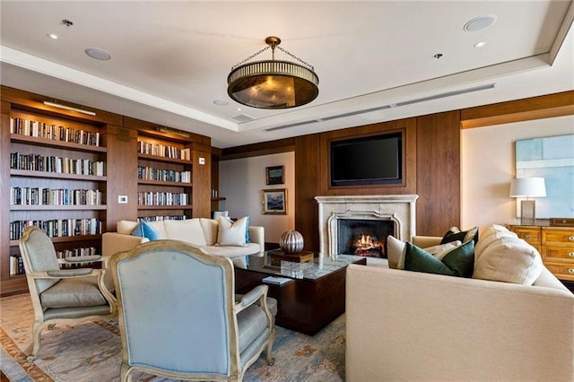 living room with a tray ceiling