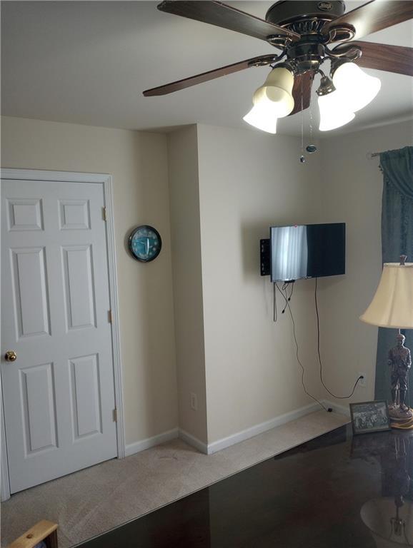 102 Ozark Trl, Canton, GA 30114 - living area with baseboards, a ceiling fan, and carpet floors
