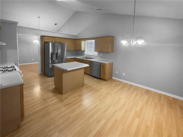 kitchen featuring a center island, a notable chandelier, appliances with stainless steel finishes, brown cabinetry, and light wood-style floors