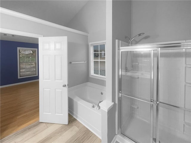 full bath featuring a garden tub, visible vents, vaulted ceiling, a shower stall, and wood finished floors