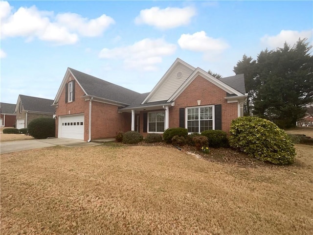 view of front facade featuring driveway, an attached garage, a front lawn, and brick siding