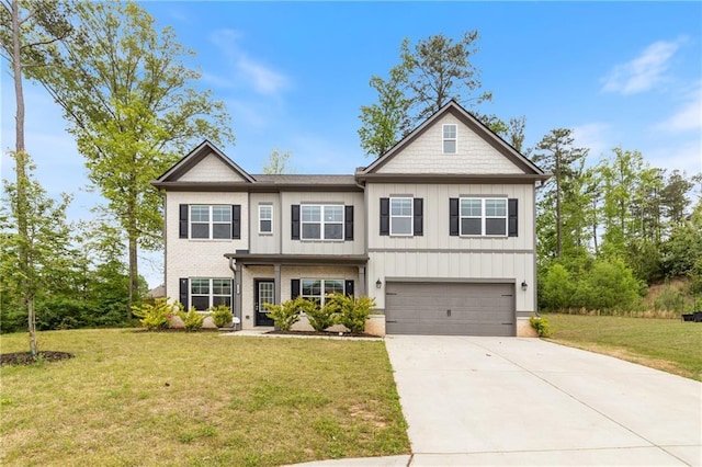 5103 Woodline View Ln, Auburn, GA 30011 - view of front of house featuring driveway, a garage, a front yard, and board and batten siding
