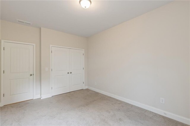 5103 Woodline View Ln, Auburn, GA 30011 - unfurnished bedroom featuring carpet, baseboards, and a closet