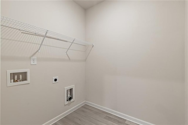 5103 Woodline View Ln, Auburn, GA 30011 - laundry area featuring hookup for an electric dryer, baseboards, hookup for a washing machine, and light wood finished floors
