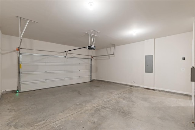 5103 Woodline View Ln, Auburn, GA 30011 - garage featuring a garage door opener, electric panel, and baseboards