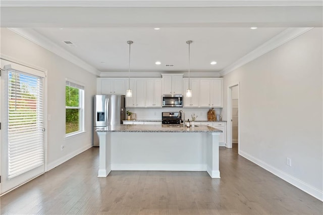 5103 Woodline View Ln, Auburn, GA 30011 - kitchen with appliances with stainless steel finishes, white cabinets, a kitchen island with sink, wood finished floors, and crown molding