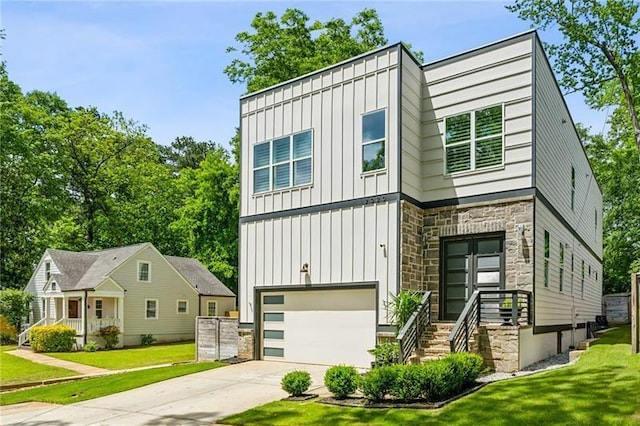 2020 Bixby St SE, Atlanta, GA 30317 - view of front of house with board and batten siding, a garage, stone siding, driveway, and a front lawn