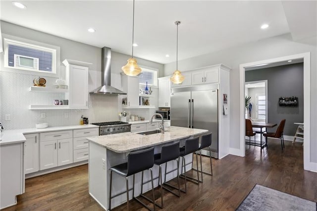 2020 Bixby St SE, Atlanta, GA 30317 - kitchen featuring wall chimney exhaust hood, open shelves, high quality appliances, white cabinetry, and recessed lighting