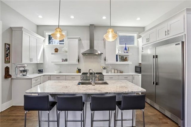 2020 Bixby St SE, Atlanta, GA 30317 - kitchen featuring stainless steel appliances, open shelves, wall chimney exhaust hood, white cabinetry, and recessed lighting
