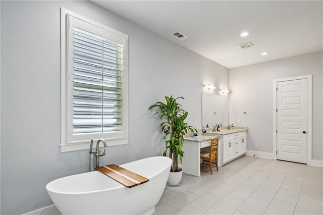 2020 Bixby St SE, Atlanta, GA 30317 - full bathroom with vanity, a freestanding bath, plenty of natural light, tile patterned flooring, and recessed lighting