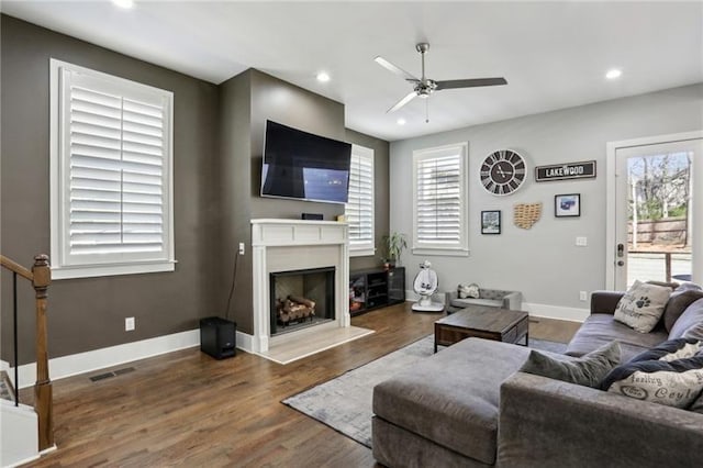 2020 Bixby St SE, Atlanta, GA 30317 - living room with a ceiling fan, plenty of natural light, wood finished floors, a fireplace, and recessed lighting