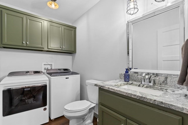 35 Indian Trce, Mineral Bluff, GA 30559 - bathroom with washer and dryer, toilet, wood finished floors, and vanity