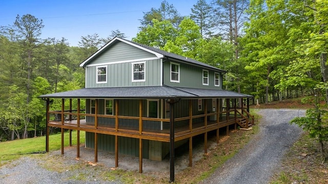 35 Indian Trce, Mineral Bluff, GA 30559 - back of property featuring board and batten siding, roof with shingles, driveway, and covered porch