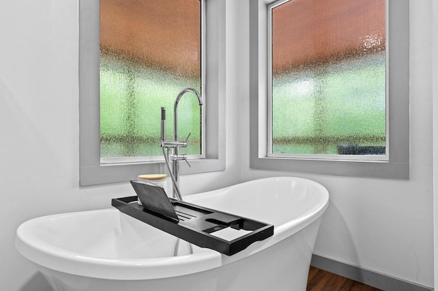 35 Indian Trce, Mineral Bluff, GA 30559 - full bath featuring a soaking tub, baseboards, and wood finished floors