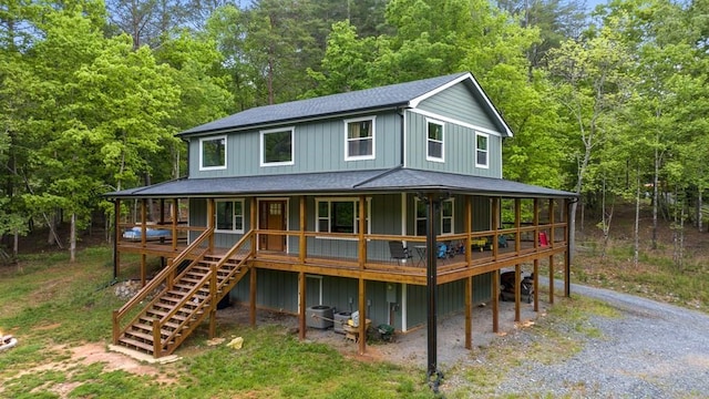 35 Indian Trce, Mineral Bluff, GA 30559 - back of property with stairway, roof with shingles, a forest view, a porch, and board and batten siding
