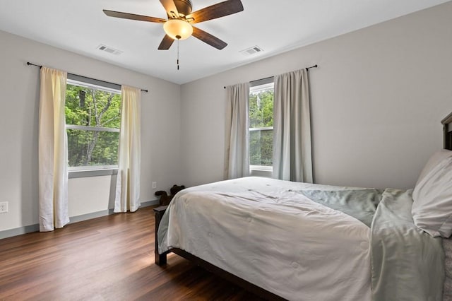 35 Indian Trce, Mineral Bluff, GA 30559 - bedroom featuring multiple windows, dark wood finished floors, a ceiling fan, and baseboards