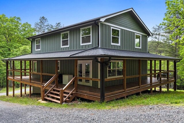 35 Indian Trce, Mineral Bluff, GA 30559 - farmhouse with board and batten siding, french doors, roof with shingles, and a wooden deck