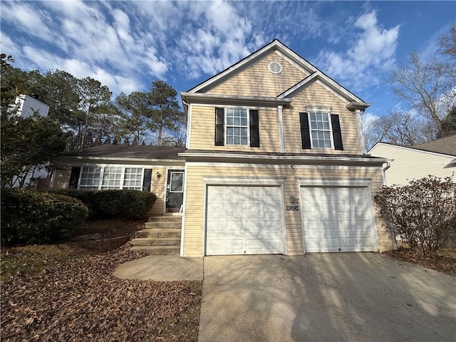 view of front facade with driveway and a garage