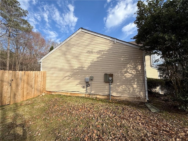 view of property exterior with fence