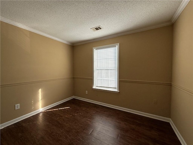 spare room with baseboards, visible vents, ornamental molding, wood finished floors, and a textured ceiling