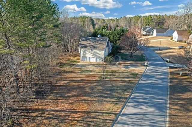 view of road with a forest view