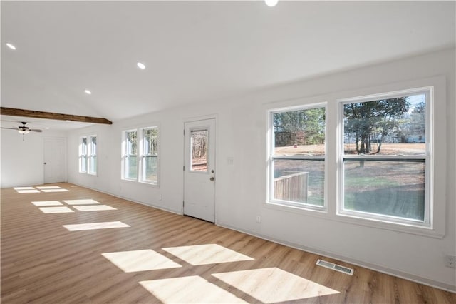 unfurnished living room with baseboards, visible vents, lofted ceiling, wood finished floors, and recessed lighting