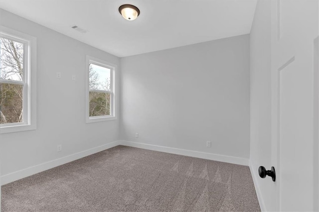 unfurnished room with carpet floors